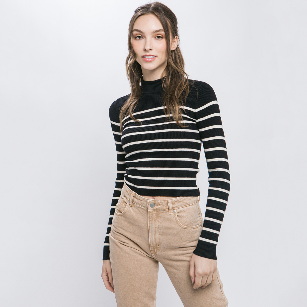 Elevate your wardrobe with this striped long-sleeve knit shirt, crafted from a soft, ribbed knit fabric. The mock neck and sleek striping detail add a stylish touch to this versatile piece. Pair it with jeans or trousers for an easy yet fashionable look.