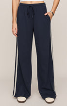 Wide-leg sweatpants with drawstring waist and contrast side stripe detail.