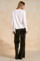 Back view of a fringe crewneck sweater.