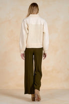 Back view of a mixed-media jacket with a textured back panel.
