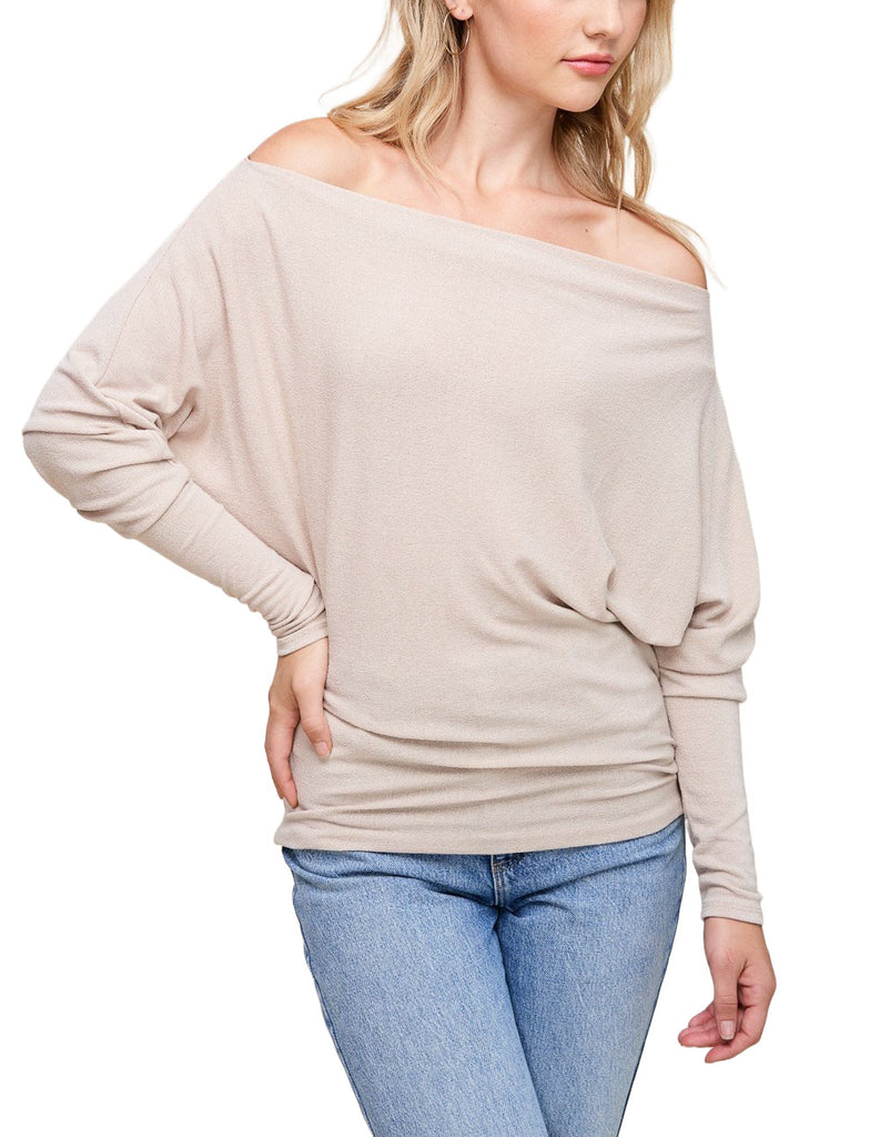 Misi Off Shoulder Crepe Top Taupe. This off shoulder crepe top comes in a soft hacci fabric and features dolman sleeves and a boat neck collar with an off shoulder design, perfect for any occasion.