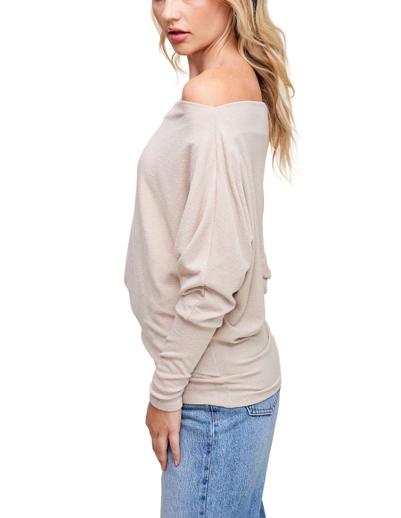 Misi Off Shoulder Crepe Top Taupe. This off shoulder crepe top comes in a soft hacci fabric and features dolman sleeves and a boat neck collar with an off shoulder design, perfect for any occasion.