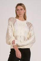 A lightweight textured sweater featuring a beautiful mix of open knit and cable detailing. The relaxed fit makes it an effortless everyday piece that pairs perfectly with denim or skirts.