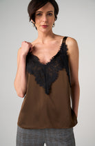 Silky camisole top with contrast lace trim, V-neckline, and wide straps.