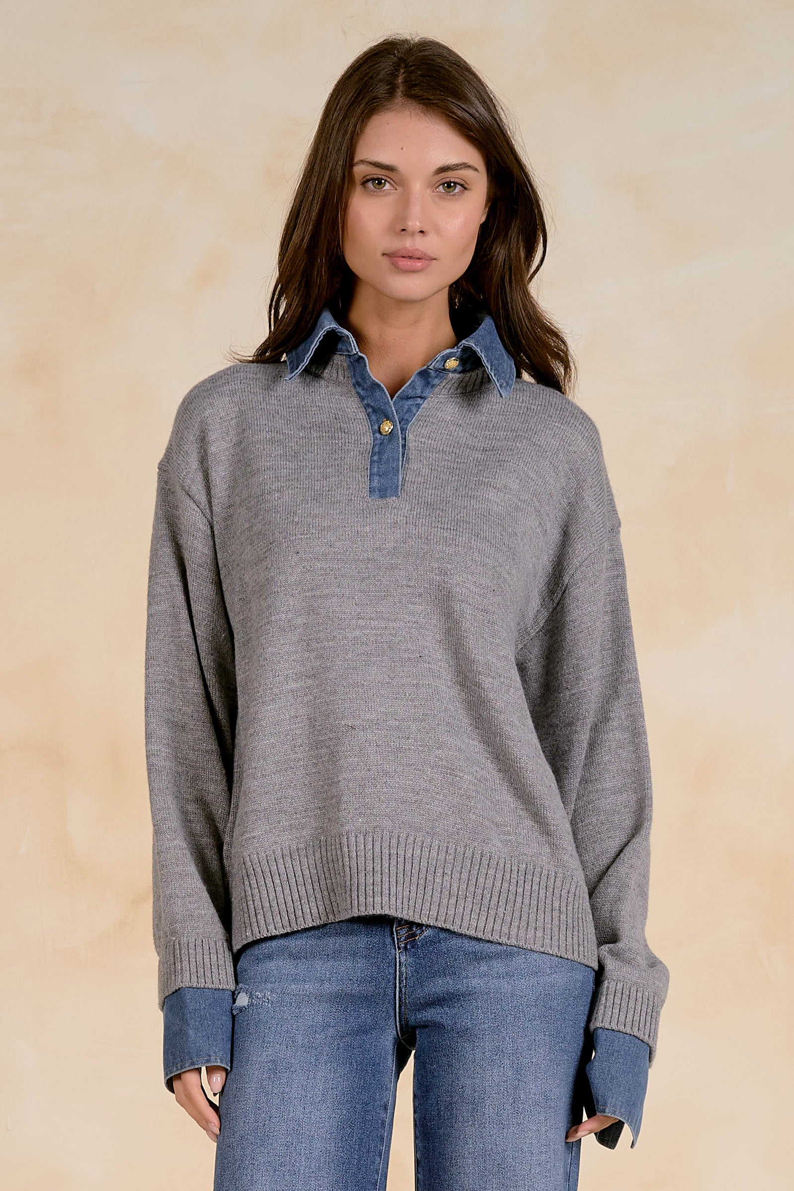 Women’s relaxed knit sweater with a contrast denim collar, partial button placket, long sleeves, and ribbed trim.