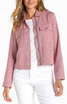 Women's cropped checkered jacket with statement buttons, flap pockets, contrast trim detailing, and long sleeves styled with white denim.