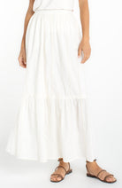 Tiered maxi skirt with an elastic waistband, delicate ladder-lace accents, and a flowy full-length silhouette.