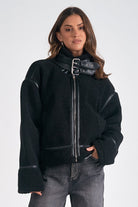 black faux shearling jacket, moto teddy coat, buckle collar jacket, edgy winter outerwear, faux leather trim coat, cozy black jacket for wome