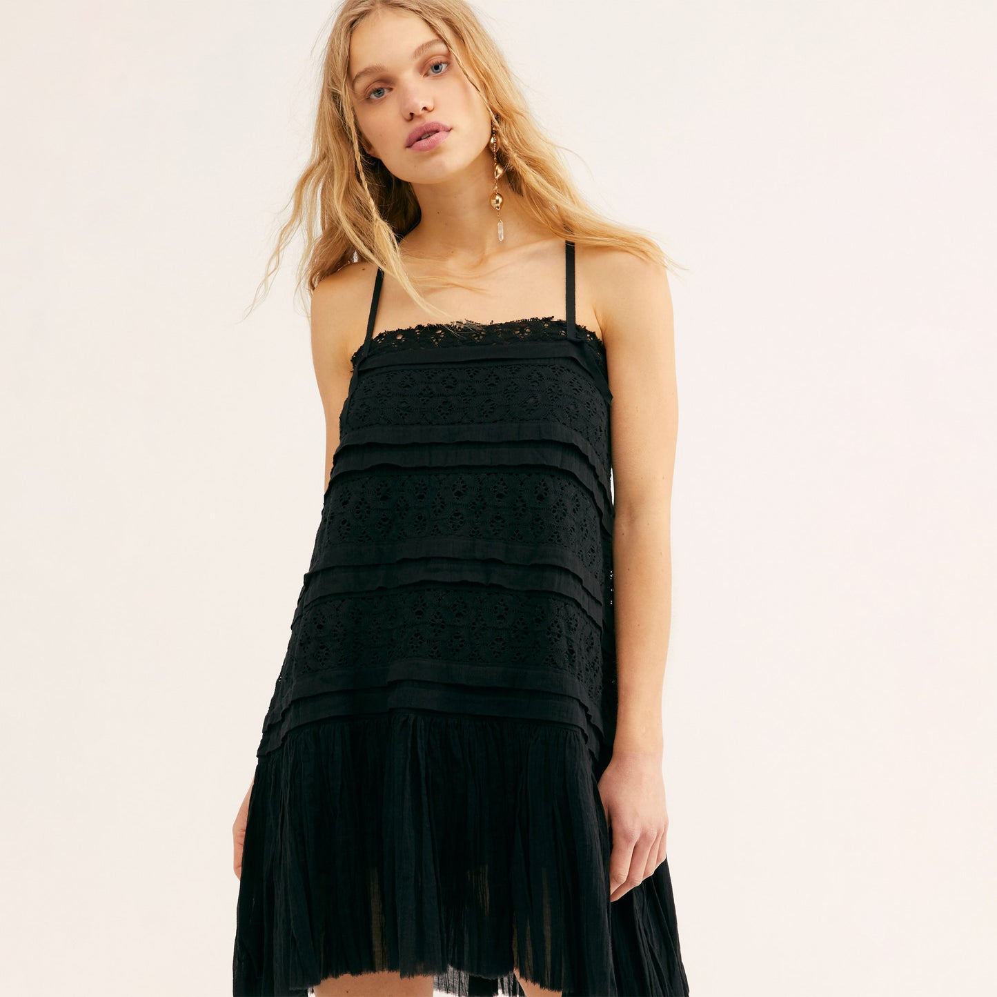 Free People Shailee Dress. This super sweet mini slip will give your look that feminine touch. Featuring a tiered detail, flowy silhouette, crochet lace paneling, gauzy ruffled skirt, adjustable straps, straight neckline, and a mini length. Style this piece with lots of jewlery and lace up sandals for the most romantic look!