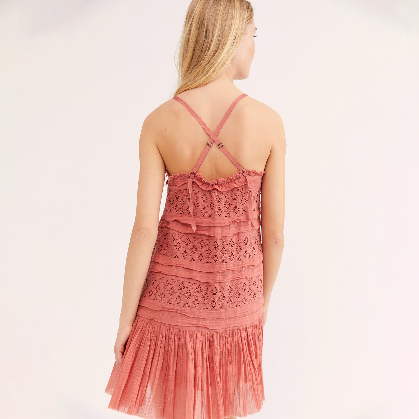 Free People Shailee Dress. This super sweet mini slip will give your look that feminine touch. Featuring a tiered detail, flowy silhouette, crochet lace paneling, gauzy ruffled skirt, adjustable straps, straight neckline, and a mini length. Style this piece with lots of jewlery and lace up sandals for the most romantic look!
