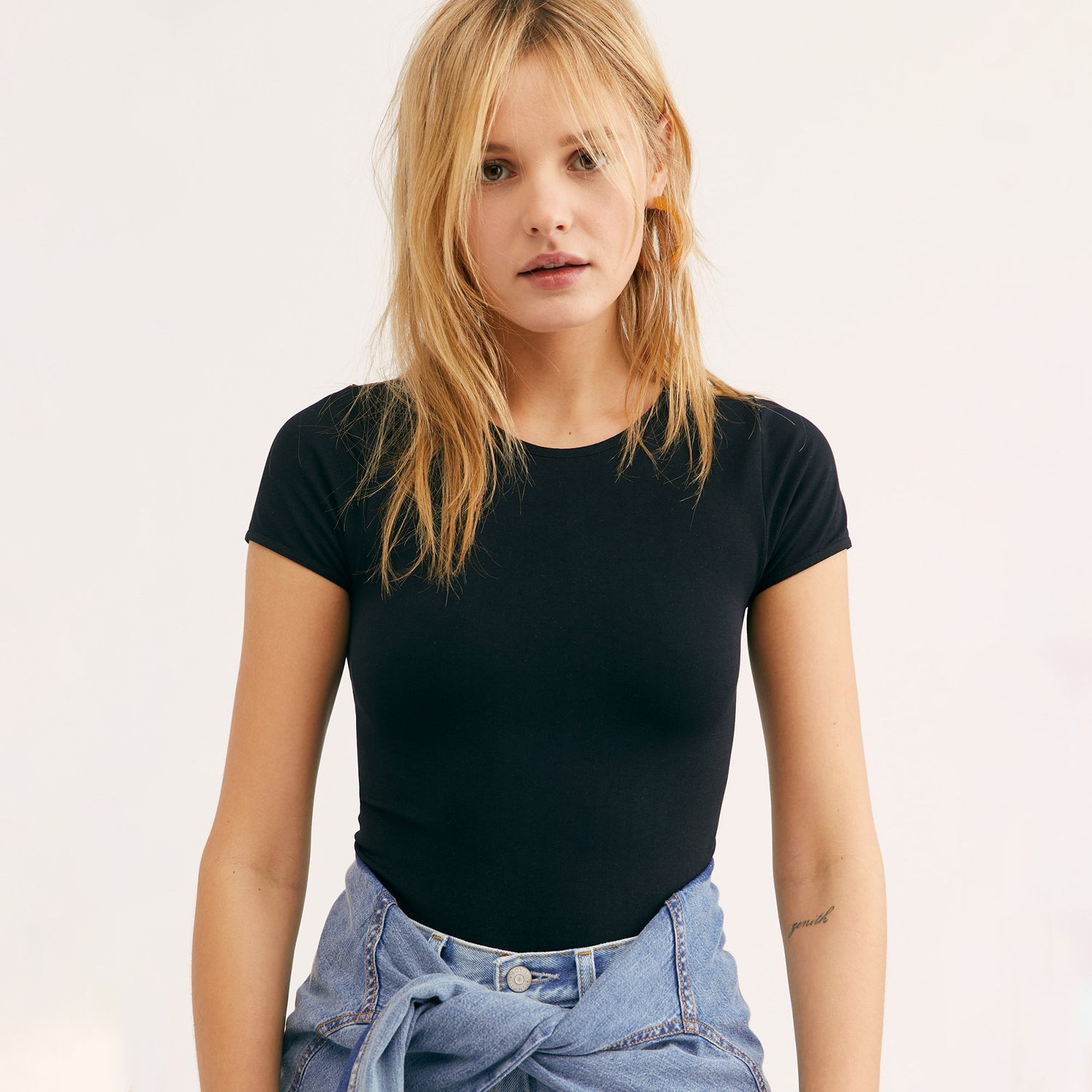 Free People Cap Sleeve Crop Top. A solid design lends versatile appeal to this cropped top by Free People. This basic crop top features a pullover style, crew neck, and short cap sleeves. Wear this with almost any bottom and sandals for a chic look.