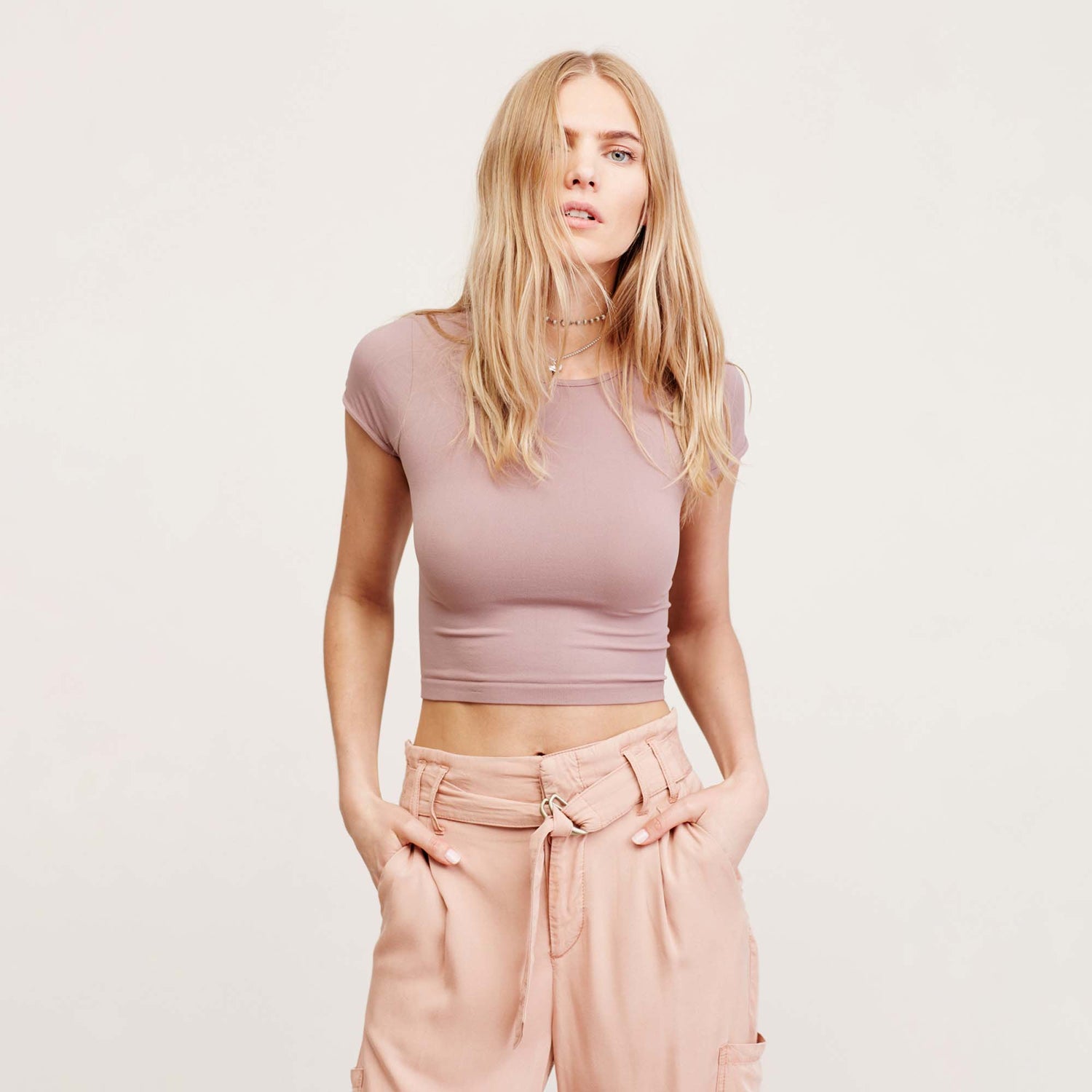 Free People Cap Sleeve Crop Top. A solid design lends versatile appeal to this cropped top by Free People. This basic crop top features a pullover style, crew neck, and short cap sleeves. Wear this with almost any bottom and sandals for a chic look.