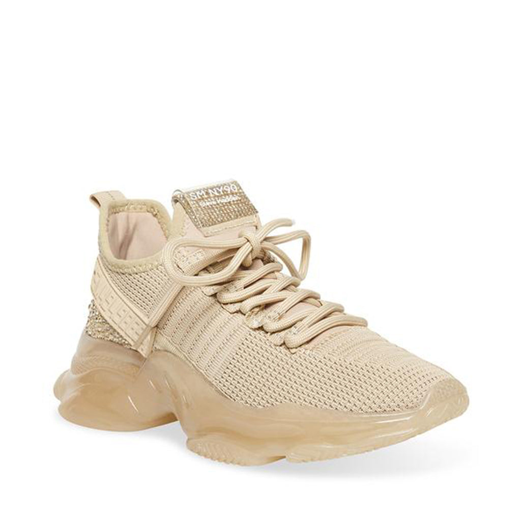 Steve Madden Maxima Sneaker. If you only rock one sneaker this season, make it the MAXIMA. A super-sleek monochromatic color palette unites this kick’s defining features, which range from a texture-blocked knit upper to an artfully sculpted sole and glitzy rhinestone embellishment. 