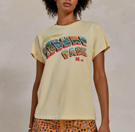 Day Dreamer Bruce Springsteen Asbury Park Tee This light yellow graphic tee features artwork from the original album cover by Bruce Springsteen. This comfy tee feels like you just left Springsteen’s concert yesterday and goes perfect with any pair of blue jeans!