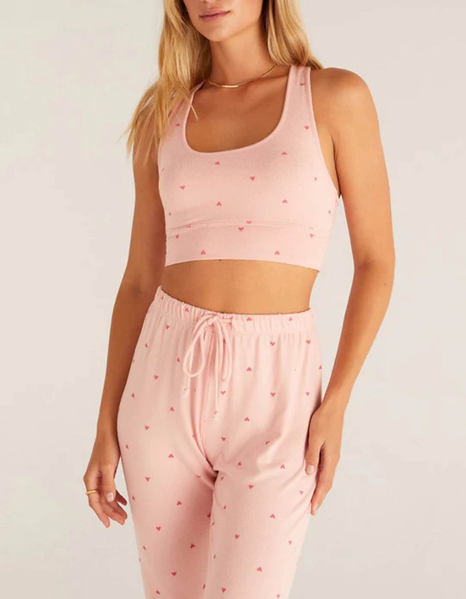 Z Supply Sia Heart Tank Bra This heart tank bra will keep you looking cute and cozy all night long, made with irresistibly soft silky jersey fabric and featuring a slim fit and flattering neckline pair it with your favorite joggers or shorts to finish the look!