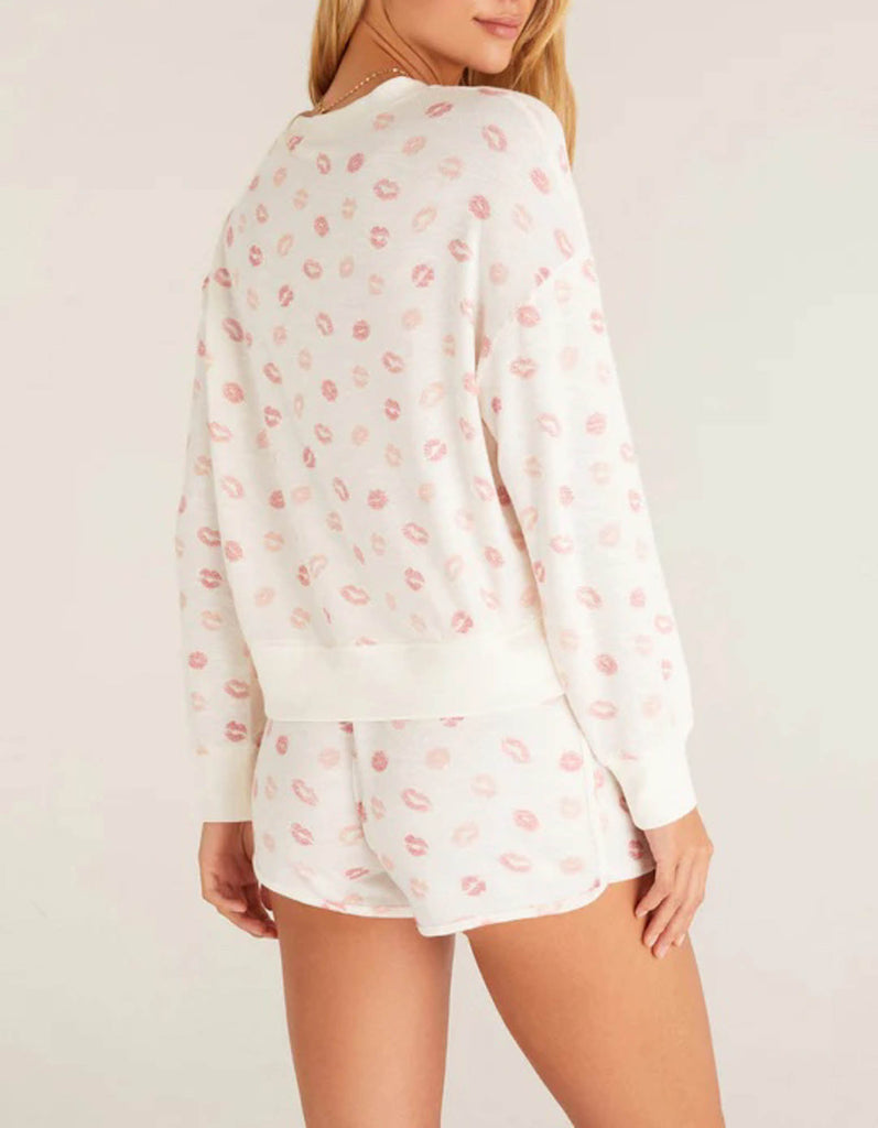 Z Supply Elle Lip Top This lips top is so soft and comfy, featuring an adorable all over kiss print with rib details it's perfect with a pair of matching shorts or joggers!