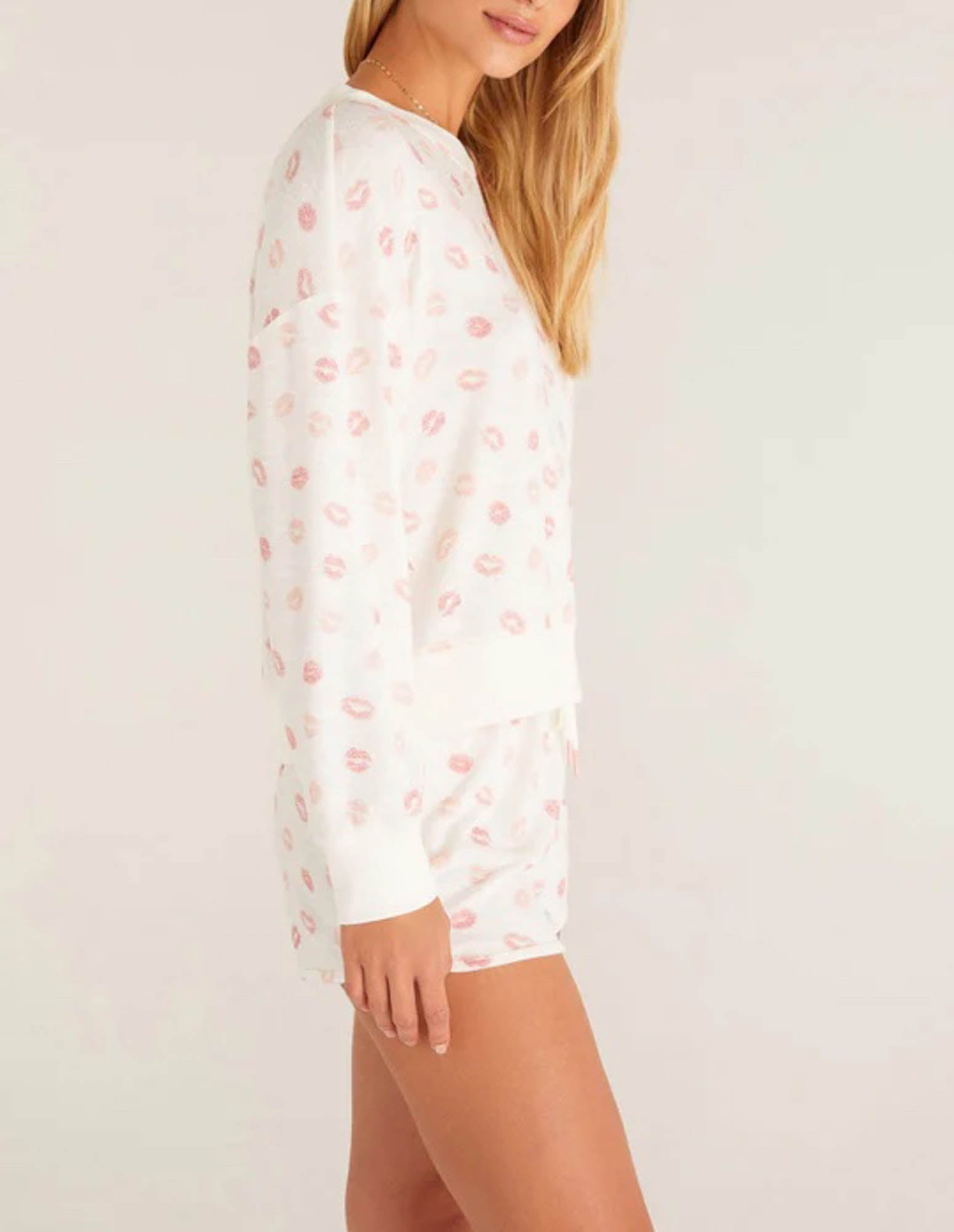 Z Supply Elle Lip Top This lips top is so soft and comfy, featuring an adorable all over kiss print with rib details it's perfect with a pair of matching shorts or joggers!