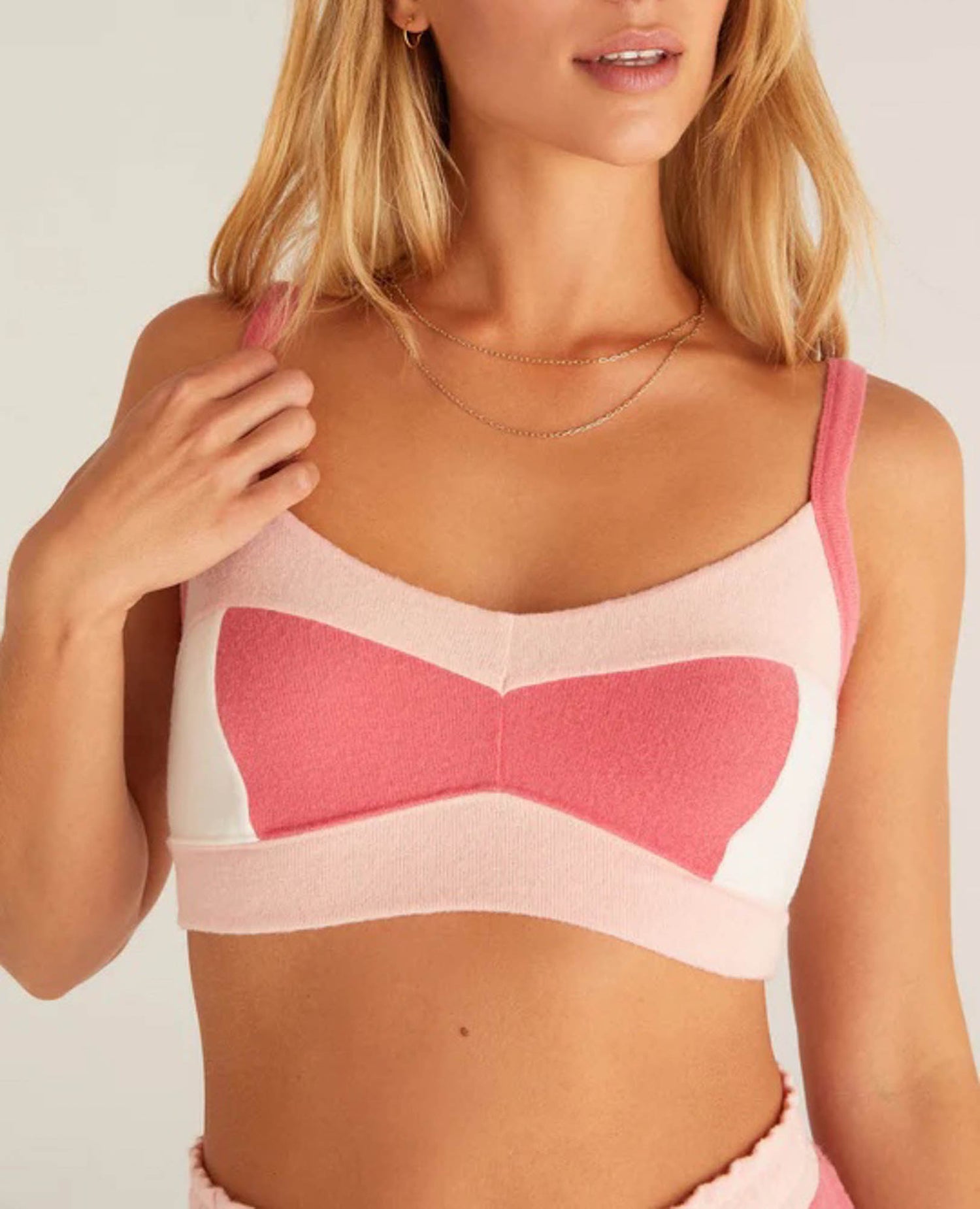 Z Supply Mix Color Tank Bra Look pretty in pink in this cute color block tank bra! This tank bra is made of ultra soft brushed sweater knit fabric and features a unique and flattering design that's to die for! Pair it with matching joggers to complete the look!