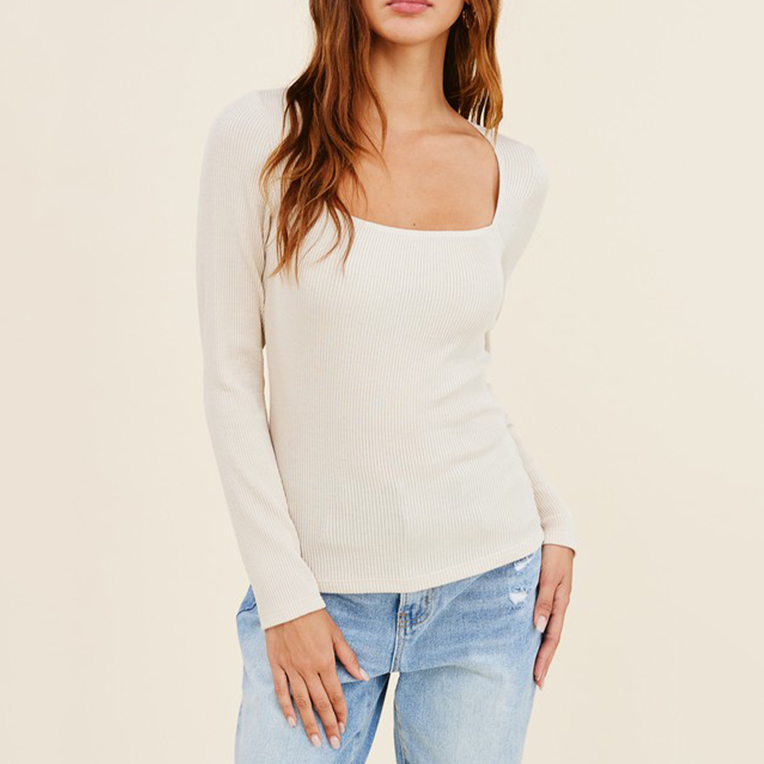 Square Neck Long Sleeve Rib Top. Ribbed knit creates a body conscious long sleeve tee that adds 90s style to your look with its square neckline