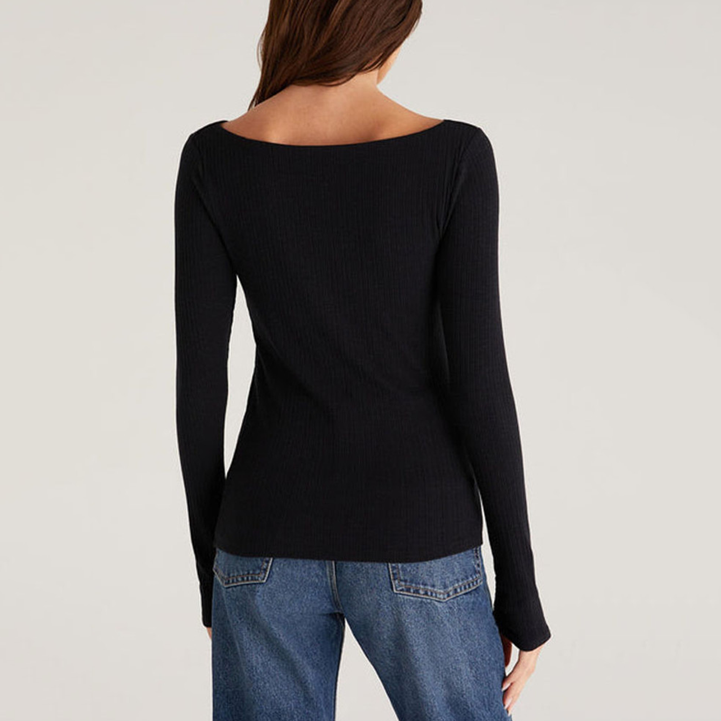 Z Supply Clara Rib Top. The fabric is to die for. You'll be cozy all day long in this soft, ribbed knit. It features a longer length so it's easy to tuck into denim or your favorite midi skirt. It has a slim, flattering fit. The Clara will be one of those basics you will be styling over and over again