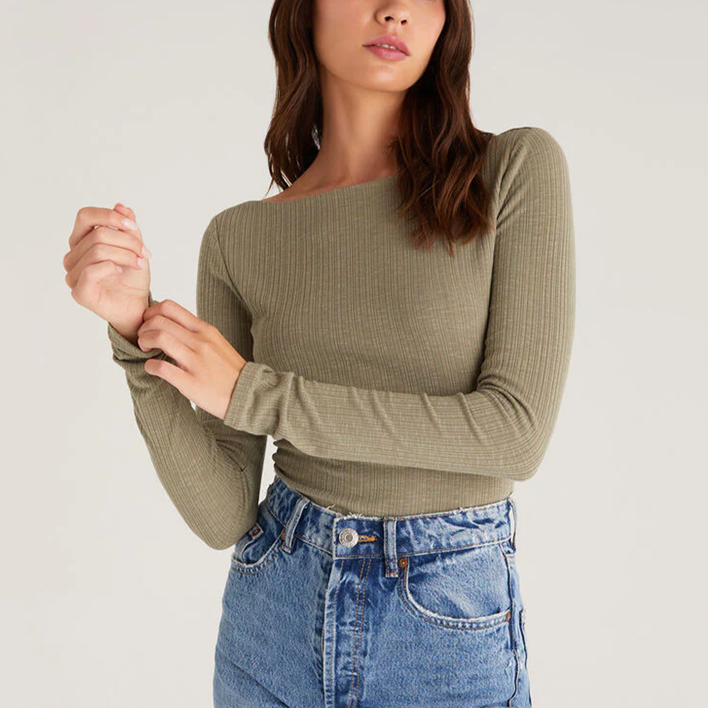 Z Supply Clara Rib Top. The fabric is to die for. You'll be cozy all day long in this soft, ribbed knit. It features a longer length so it's easy to tuck into denim or your favorite midi skirt. It has a slim, flattering fit. The Clara will be one of those basics you will be styling over and over again