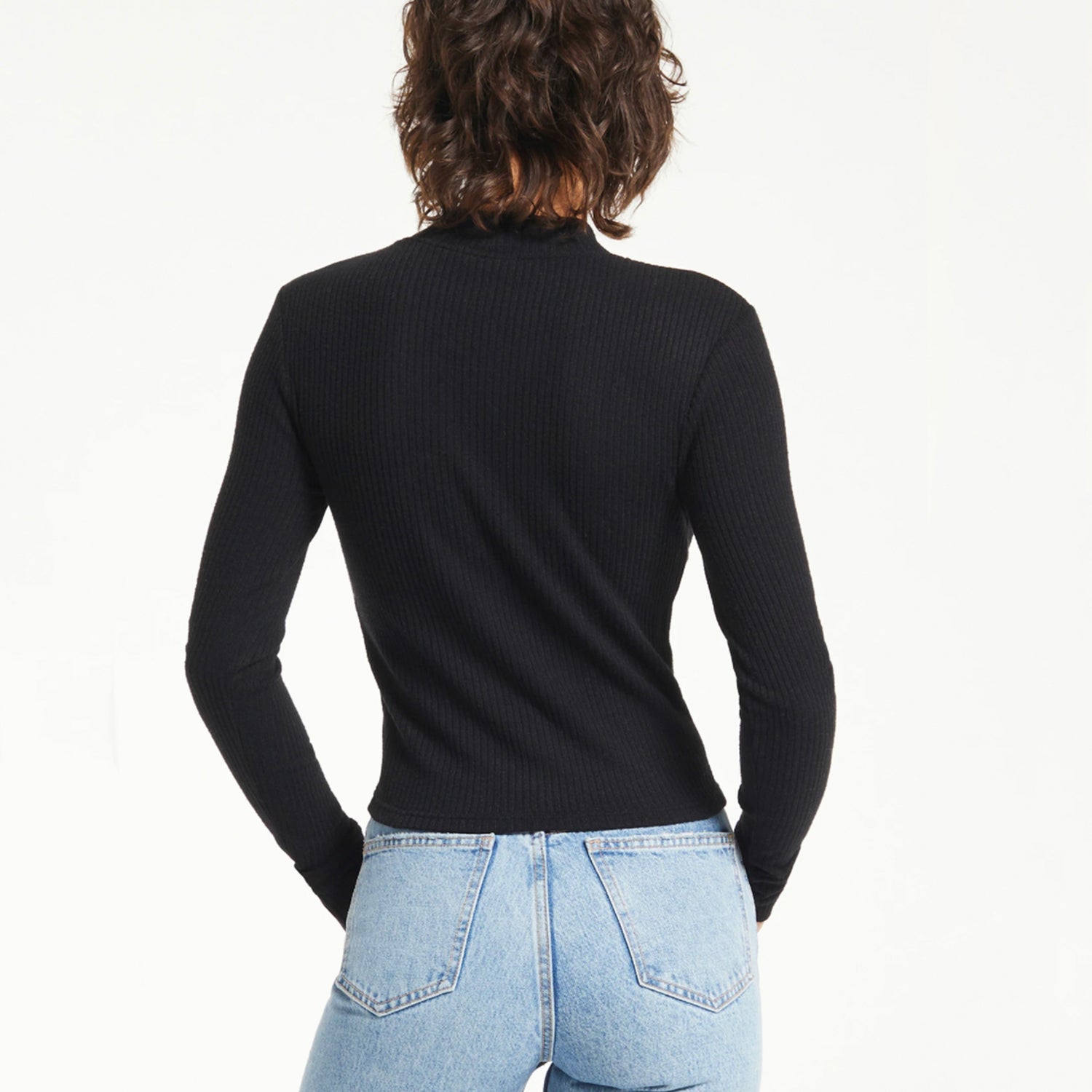 Z Supply Clarke Rib Long Sleeve Top. The soft textured rib creates an elevated, and flattering silhouette. This top will be that effortless addition with its fitted look, mock neck, and cuffed sleeve. Make it that must have!