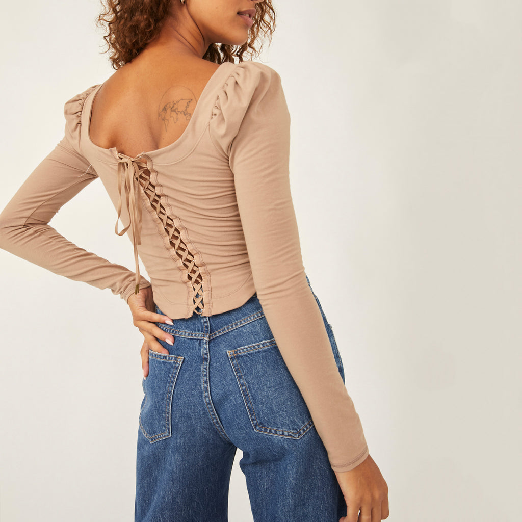 Free People Willow Top. A lace-up back, pronounced rounded hem, and voluminous shoulders add just the right amount of drama to the Free People Willow Top