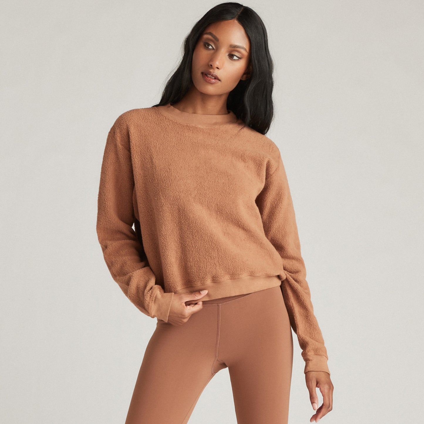 Strut This Georgie Sweatshirt. This slightly cropped pullover is a cold-weather essential. Made from ultra-soft fibers and designed with a chic high neck, this sweatshirt will keep you warm and comfortable all season long.