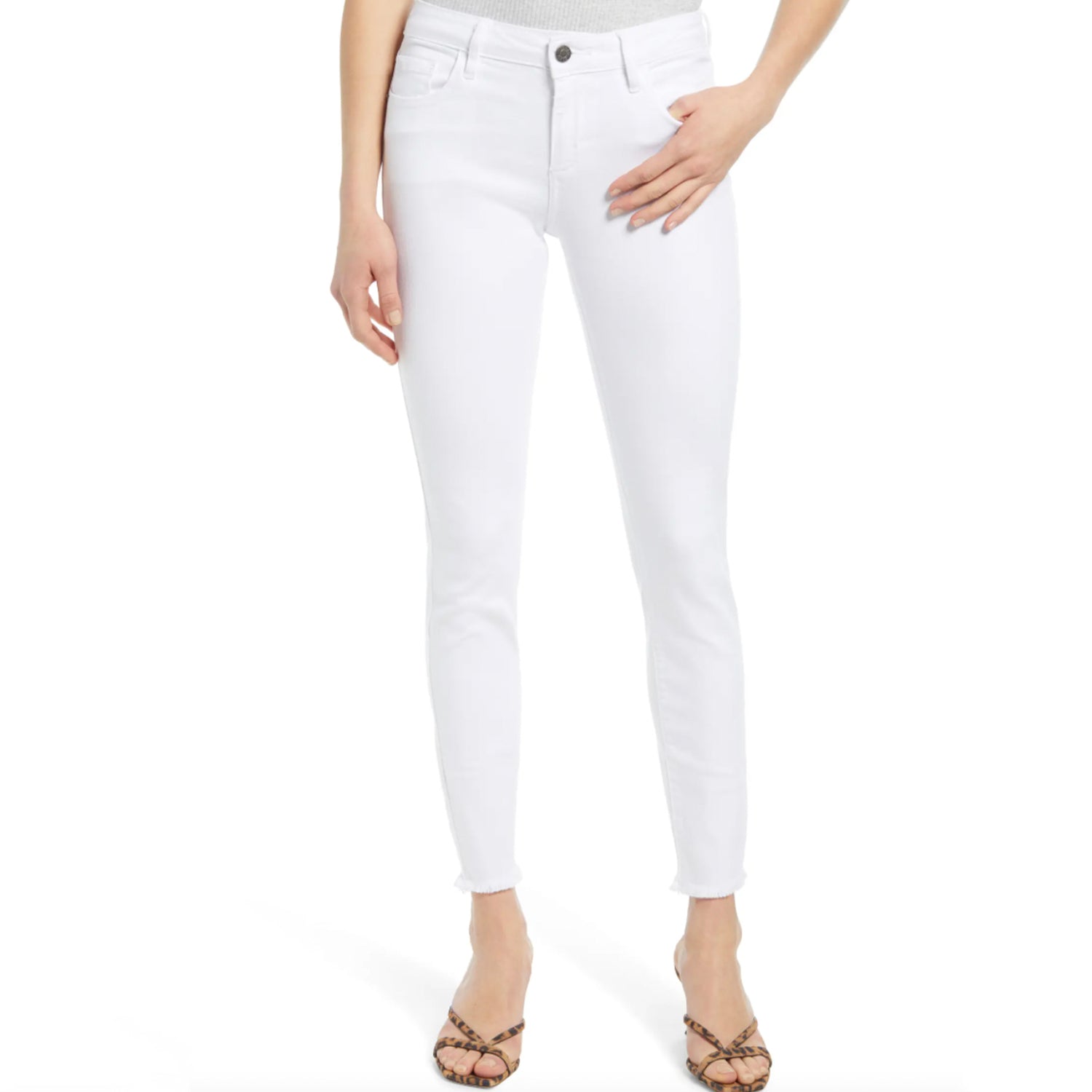 Hidden Amelia Mid Rise Frayed Hem Skinny Jeans. Welcome white-jeans season in this stretch-kissed pair of jeans finished with a trendy frayed hem
