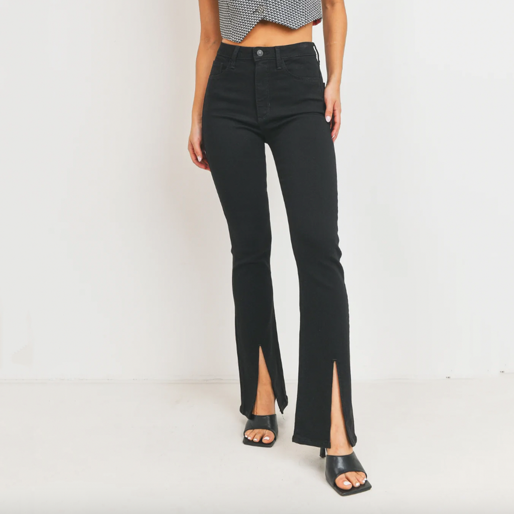 Just Black Denim High Rise Front Slit Flare. With a subtle flare and not-so-subtle front-facing slits, this is the perfect pair to show off your cutest shoes while keeping it chic in a high rise waist and true black rinse
