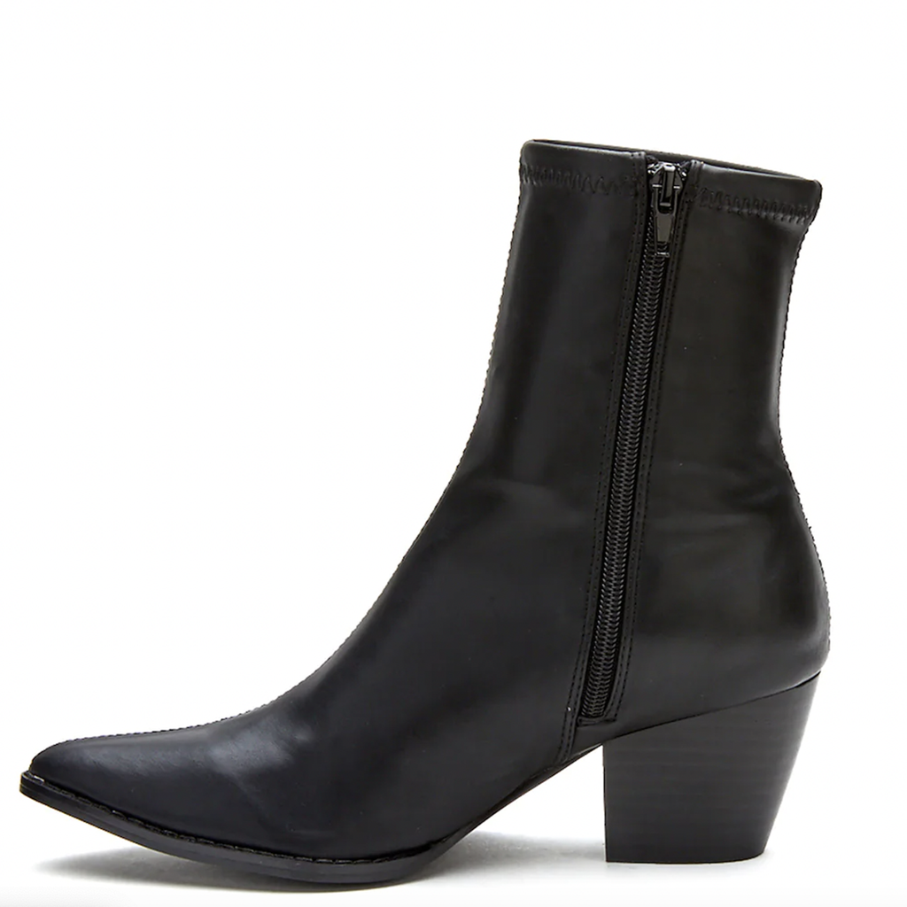 Kyra Bootie. Step up your fashion game with the Kyra bootie from Coconuts. Featuring vegan synthetic upper, a stylish pointed toe, and stacked heel, this Western-inspired sock bootie is secured with zipper closure for a tight fit and has traction sole for added support