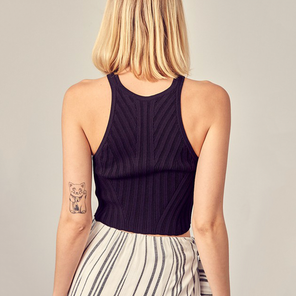 Ribbed Halter Knit Tank Top. We all need a little throw-on-and-go crop top like this Ribbed Halter Knit Tank Top! This cute top is made from a stretchy, ribbed knit and features a sleeveless, fitted bodice with a high neckline and racerback design