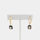 Round hoop earrings with dangling enamel cubic zirconia gem. The gem is removable, you may wear it alone as huggies or add one of our other charms or pendants to change up the look