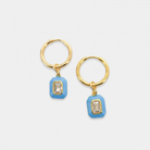 Round hoop earrings with dangling enamel cubic zirconia gem. The gem is removable, you may wear it alone as huggies or add one of our other charms or pendants to change up the look