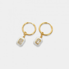 Round hoop earrings with dangling enamel cubic zirconia gem. The gem is removable, you may wear it alone as huggies or add one of our other charms or pendants to change up the look