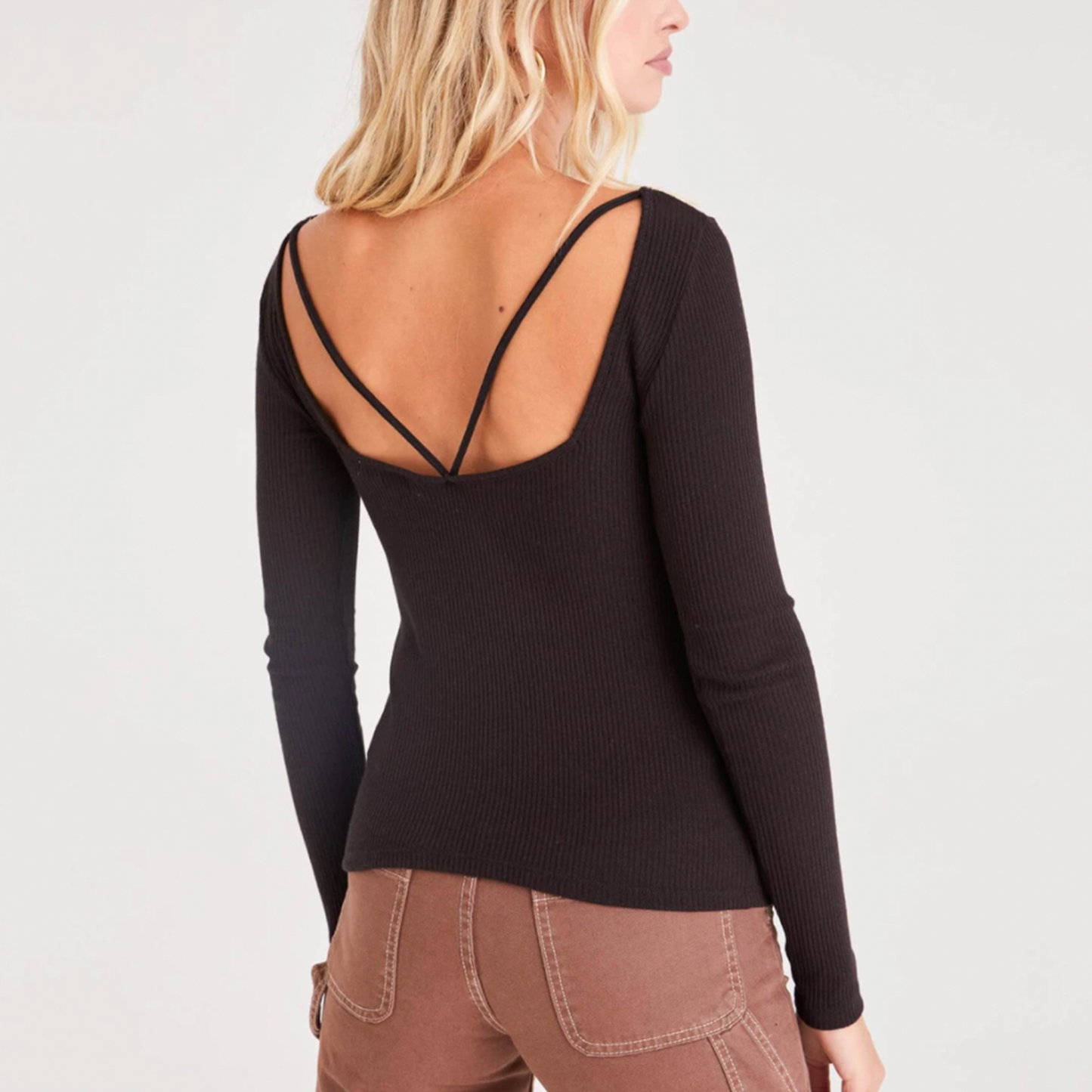 Project Social T Minah Scoop Back Long Sleeve. Body skimming and ultra flattering, a top that you're going to want to show off, especially the back. Made in a soft ribbed fabric, this top features a strappy scoop back. Wear with your favorite bottom, because this top will elevate any look