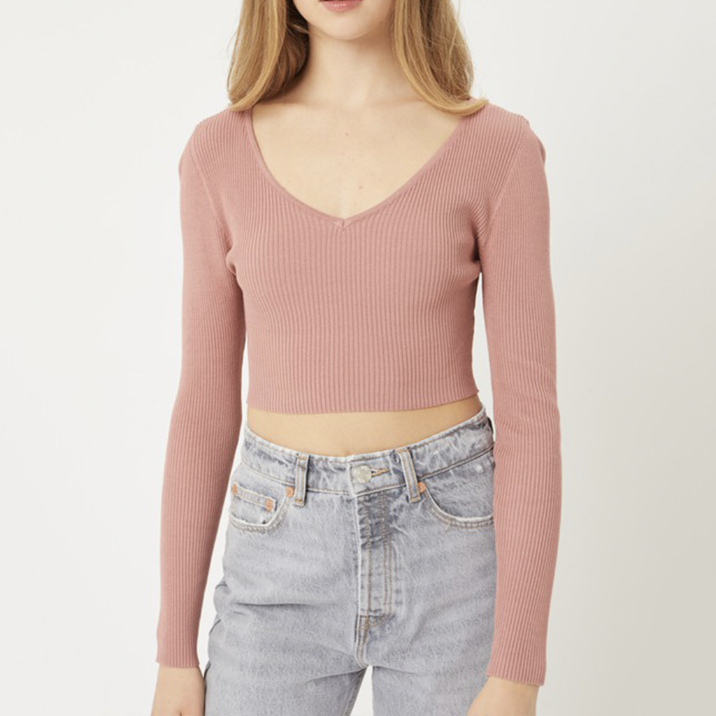 Moonbeam V Neck Long Sleeve Rib Crop Top. This top is perfect for dressing up or down. Featuring a ribbed material with a V neckline and long sleeves, what's not to love about it? A long sleeve top is sure to be a staple in your new season wardrobe and we are obsessing over this one