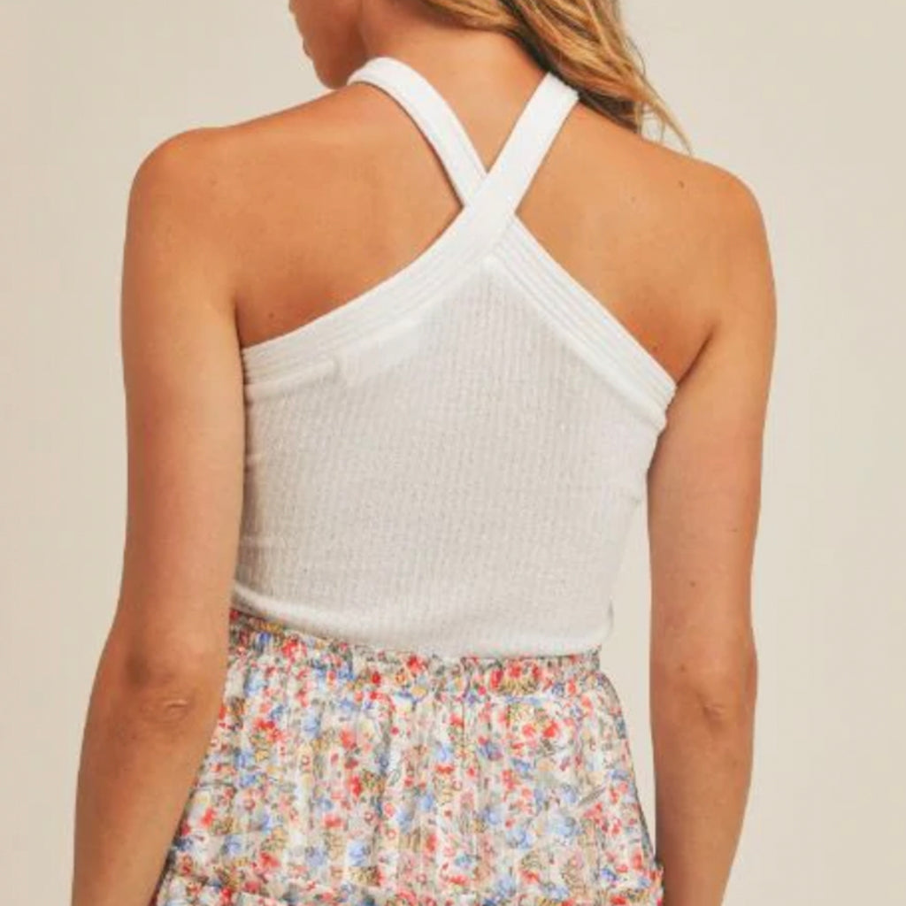 Sage The Label When She Smiles Halter Top. The perfect top for spring and summer! This basic white halter is great to pair with any fun patterned bottoms or a fun jacket when it gets cooler at night