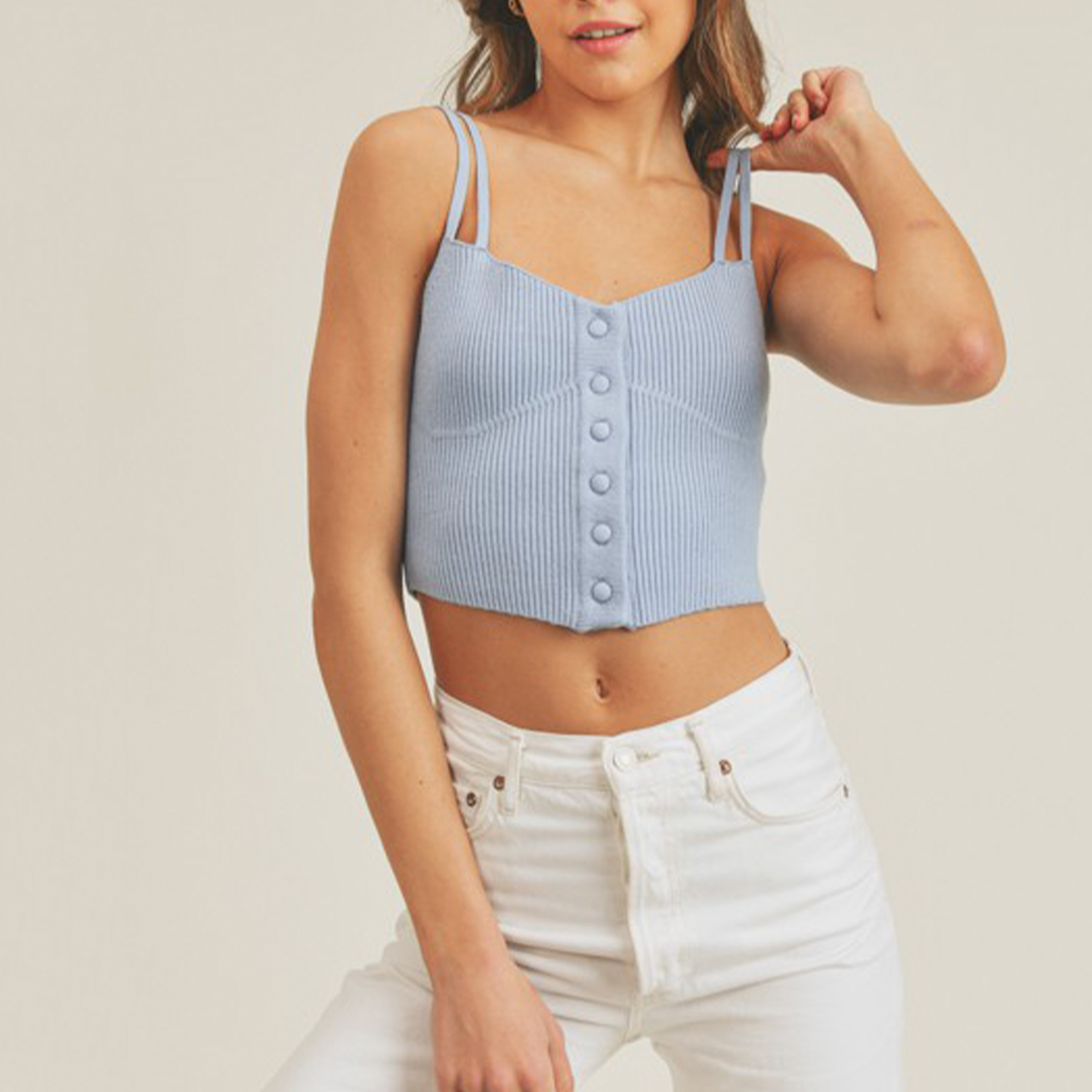 Knit Button Front Tank Top. Looking good comes easy when you've got the Knit Button Front Tank Top! Stretchy ribbed sweater knit shapes this cute top with a cropped hem