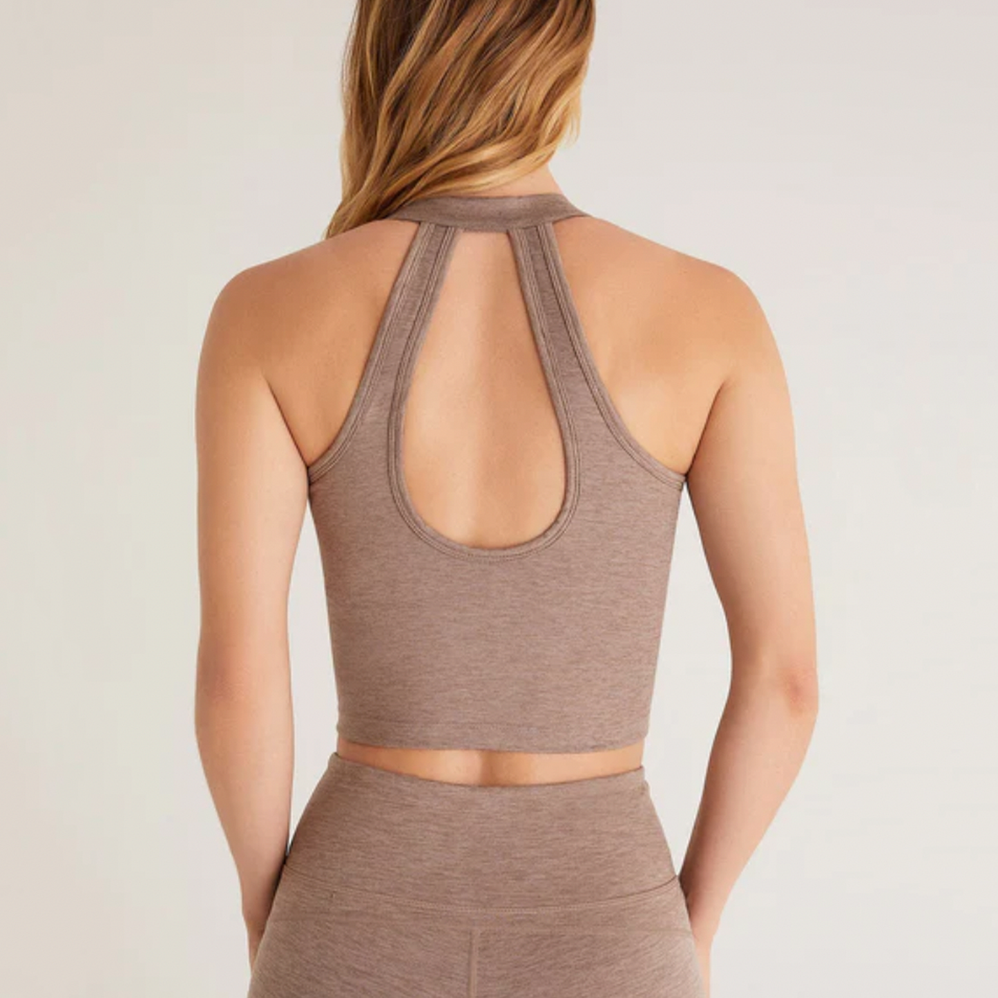 Z Supply Downward Crop Tank. Ultra comfy yet chic, the Downward Sports Bra is made in a soft, moisture-wicking, Simply Brushed polyester spandex fabric. This cropped tank sports bra features a shelf bra with removable pads and a flattering scoop back detail that sets it apart from other sports bras